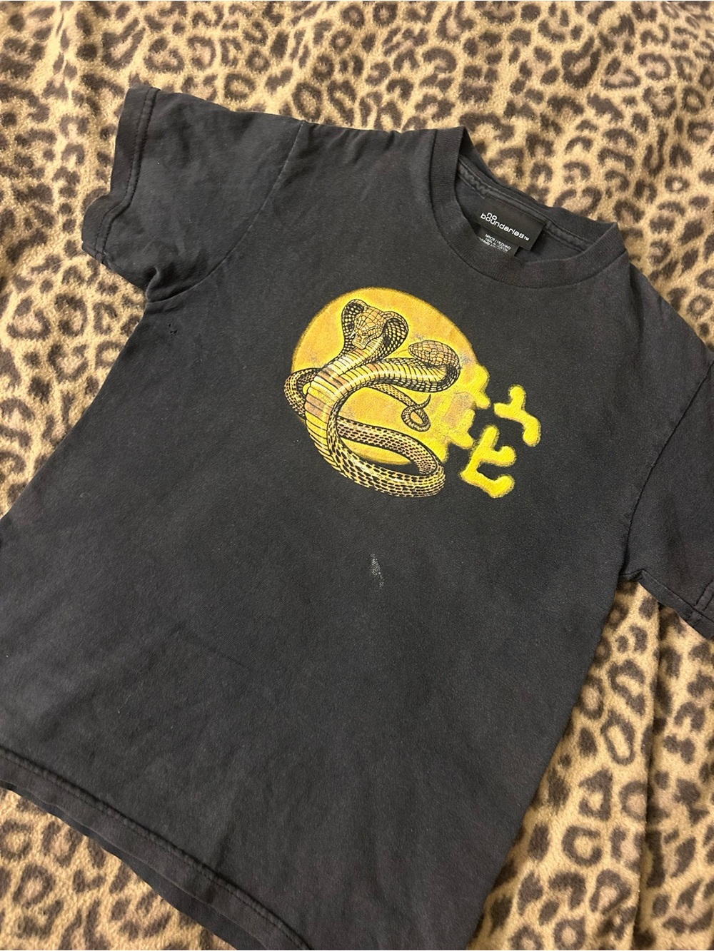 No Boundaries Black Baby Tee with Yellow Cobra Graphic